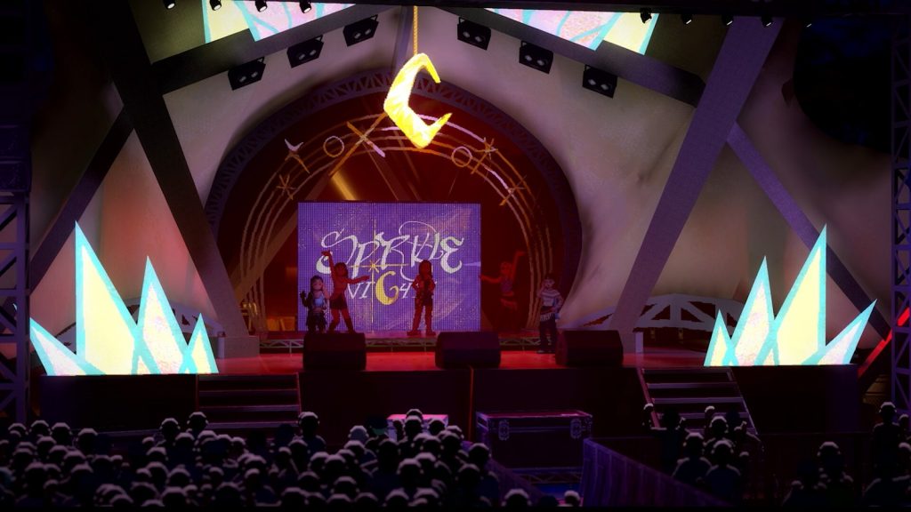 Une scène de concert vue depuis la foule, projecteurs, écran orné de lettres stylisées et décors en éclats lumineux