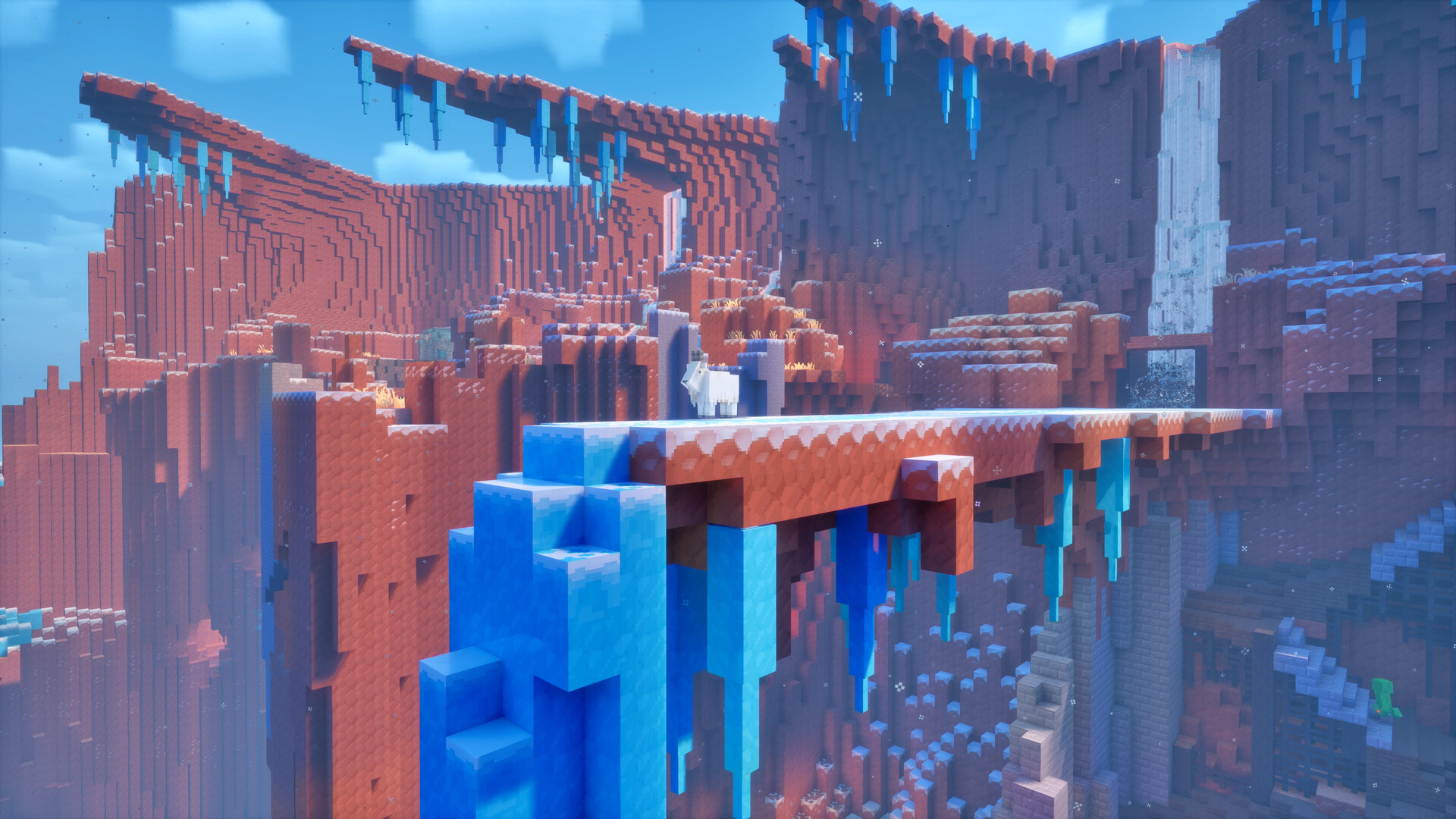 Des falaises cubiques de roche rouge traversées d'un pont de glace bleue, sous un ciel pâle