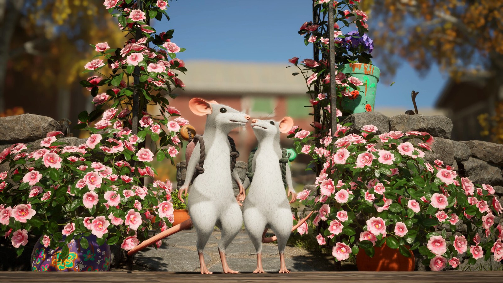 Deux souris blanches debout au milieu de fleurs roses, devant une maison, dans Hela: of Mice & Magic.