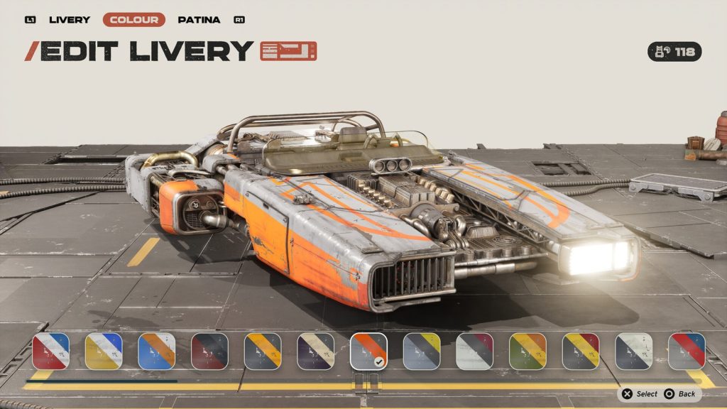 Un écran de personnalisation intitulé EDIT LIVERY, montrant un module orange et blanc et une rangée de coloris.